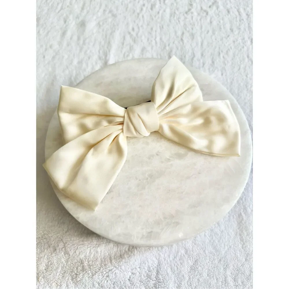 Cream satin hair bow with barrette snap